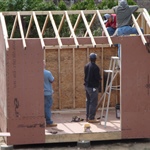 Workers building a house